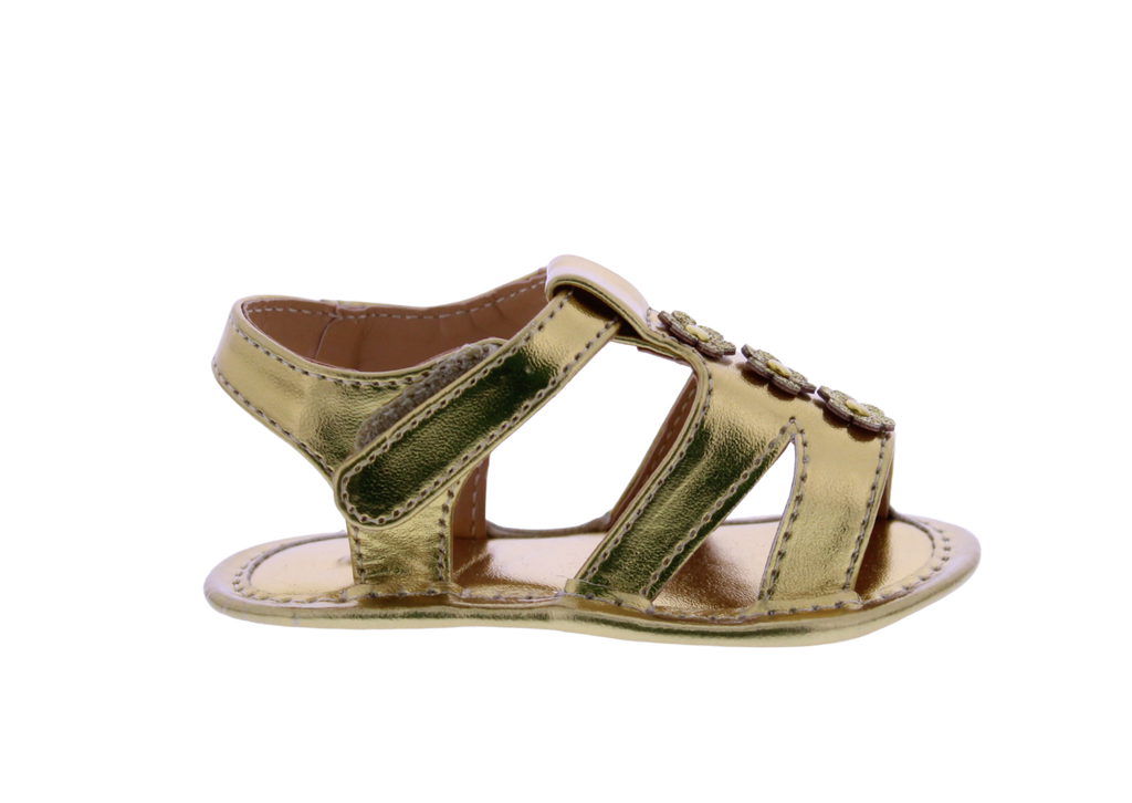 Gold sandal on a white background