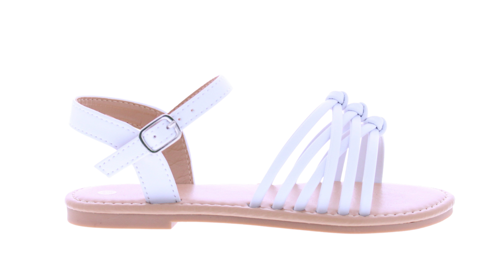 A single white flat sandal with multiple thin straps across the foot and an adjustable ankle strap with a silver buckle, shown in side profile on a white background.