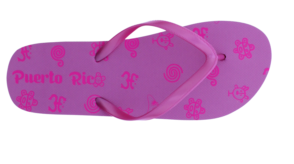 A single pink flip-flop sandal with a purple-pink footbed decorated with small cartoon faces and the words 'Puerto Rico' printed vertically, shown on a plain white background.