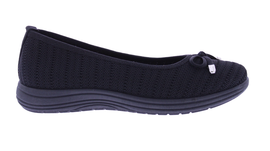 A single women's knit slip-on shoe in black, shown in a side profile view against a plain white background.